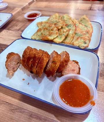 Fried meat slices with red sauce and fried rolls at Uncle Soon Plus Kitchen House