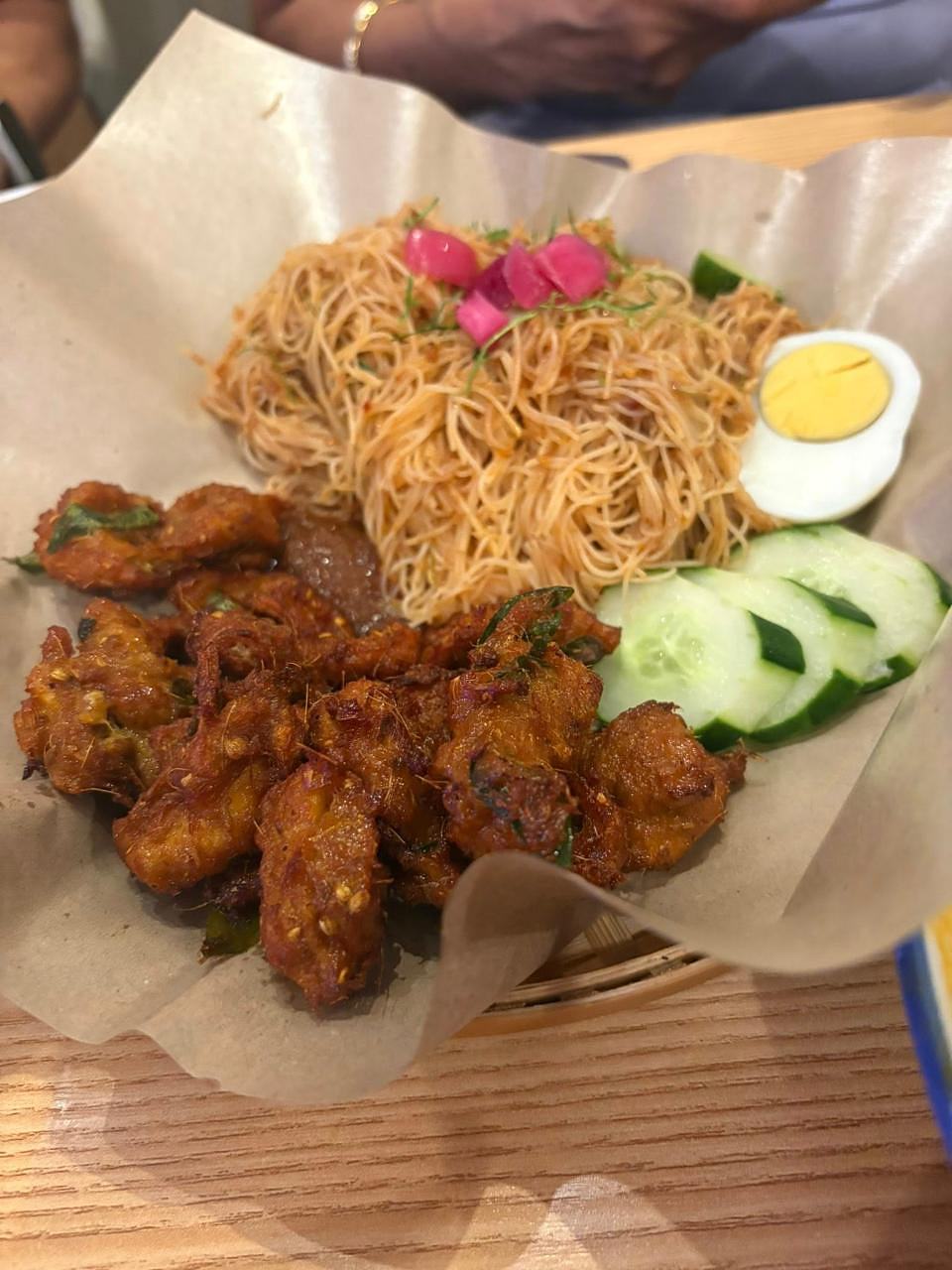Mee celup with crispy fried chicken, boiled egg, cucumber, and pickled radish at Bibi's Popiah