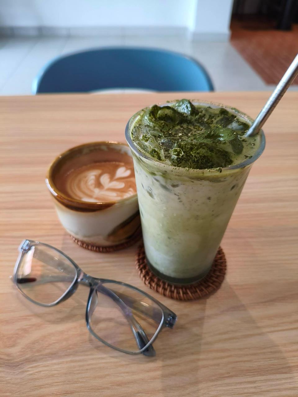 Matcha and latte art drinks on a wooden table at Kiara SS19