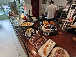 Kiara SS19 bakery counter with fresh breads, pastries, and cakes