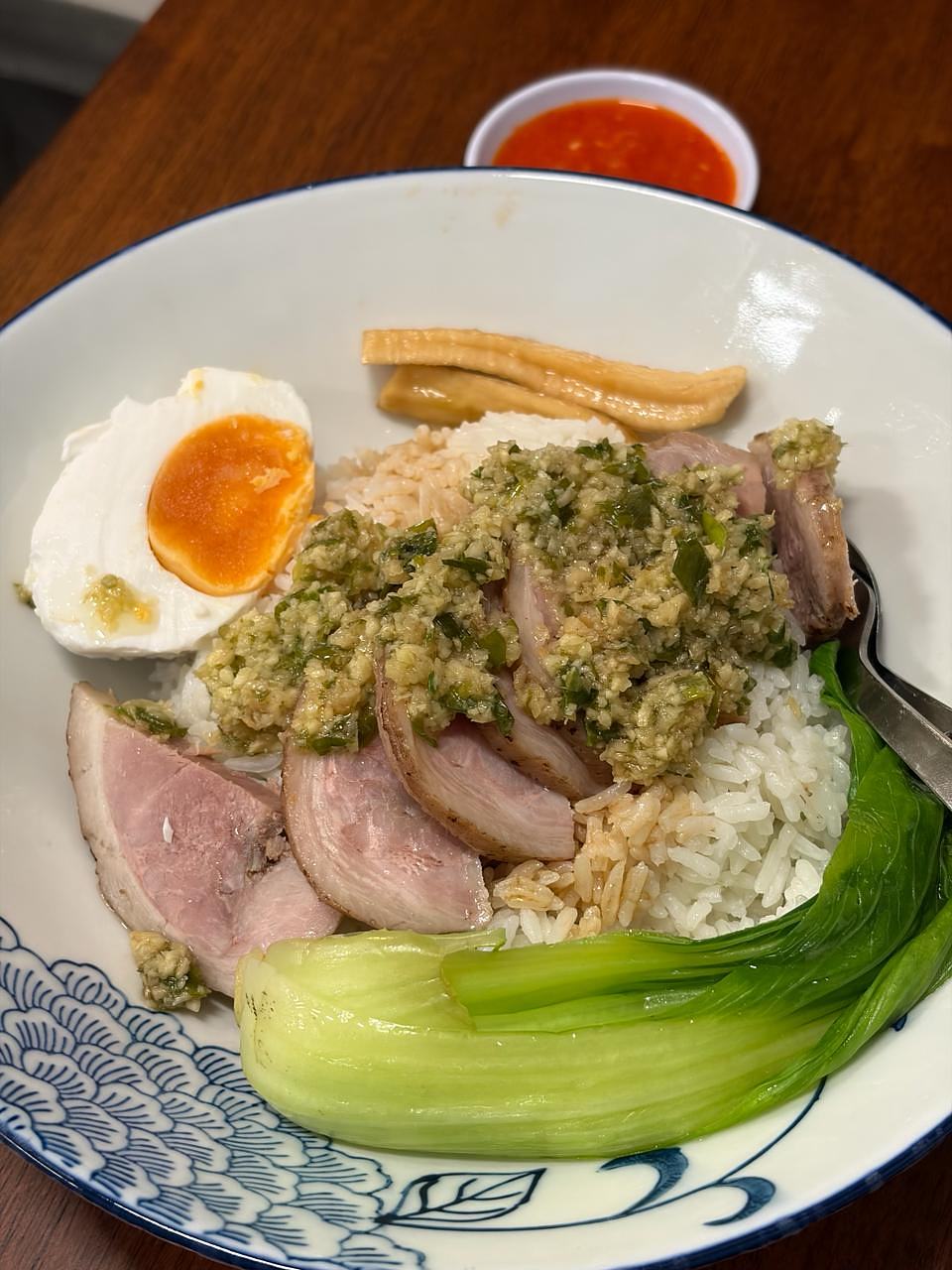 Sliced meat with herb sauce, soft-boiled egg, rice, and bok choy at Ming Kee Cantonese Taipan