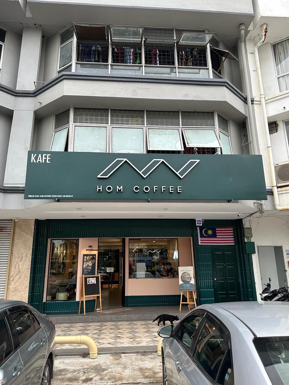 HOM Coffee storefront at Taman Subang Permai, USJ 1 — dark green signboard with white lettering above a glass entrance