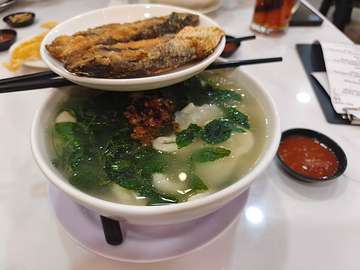 Traditional Mee Hoon Kuey soup with dumplings, leafy greens, and fried meat topping at Restaurant Bahao SS14