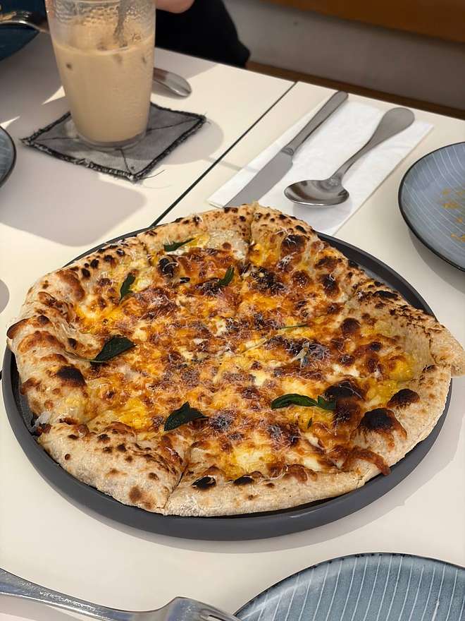 Wood-fired pizza or dish at The WoodFire Club SS15