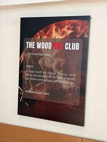 Wood-fired pizza or dish at The WoodFire Club SS15