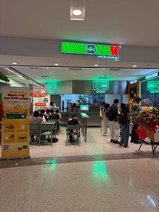 NakNak Sunway Pyramid storefront with green neon sign and ordering counter