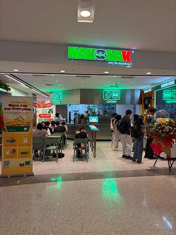 NakNak Sunway Pyramid storefront with green neon sign and ordering counter