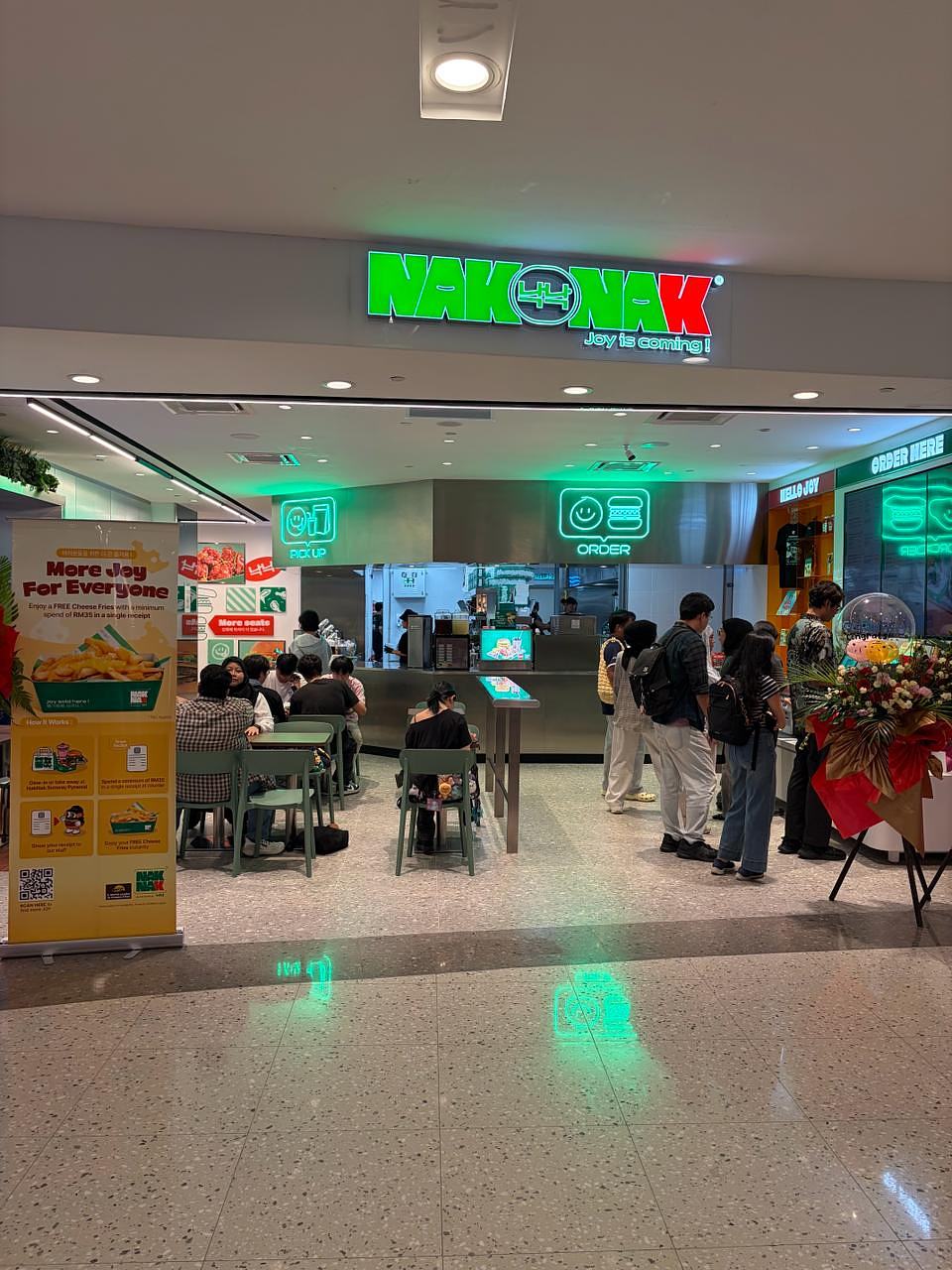 NakNak Sunway Pyramid storefront with green neon sign and ordering counter