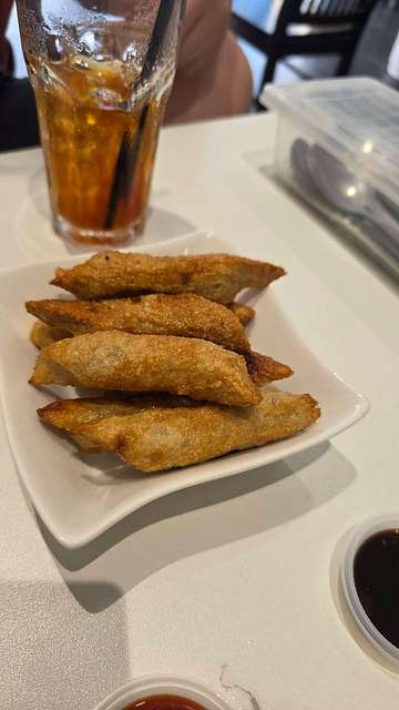 Keropok lekor on a white plate with iced tea at Capital Nasi Dagang Kelantan SS15