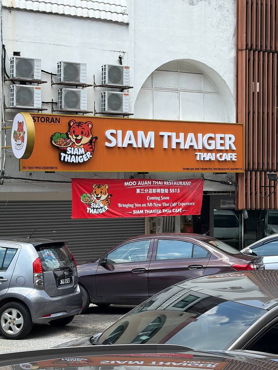 Siam Thaiger Thai Cafe SS15 storefront exterior with orange tiger signage and coming soon banner