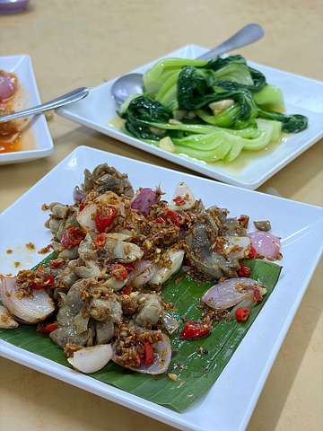 Asian stir-fry dish garnished with peanuts